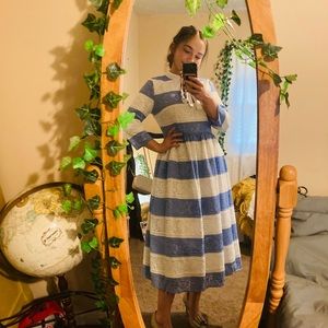 Dainty Jewell’s blue and white striped dress.